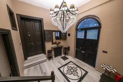 a hallway with a chandelier in a house at Balkon Residence in Istanbul