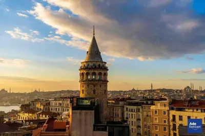 a tall tower with a steeple on top of a building at Balkon Residence in Istanbul