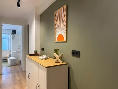 a kitchen with an island with a wooden counter top at Stunning Combo Flat in Nisantasi in Istanbul
