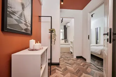 a bathroom with a vanity and a room with a bedroom at Bright & Modern 2-Bedroom Flat Near Metro in Istanbul