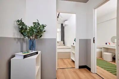 a room with a hallway with a vase on a table at Stylish 2BR in Central Istanbul 3-Min to Metro in Istanbul