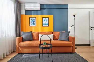 a living room with a couch and a table at Superb Location 3 Min to Metro AC Elevator in Istanbul