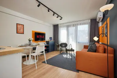 a living room and kitchen with a couch and a table at Superb Location 3 Min to Metro AC Elevator in Istanbul