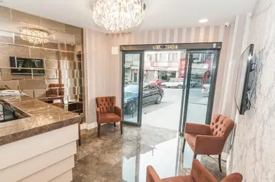 a lobby of a store with chairs and a glass door at Park Grazza Hotel in Istanbul