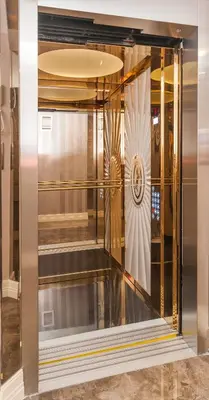 a glass elevator in a room with a staircase at Park Grazza Hotel in Istanbul
