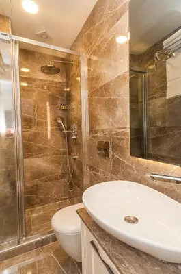 a bathroom with a sink and a shower at Park Grazza Hotel in Istanbul