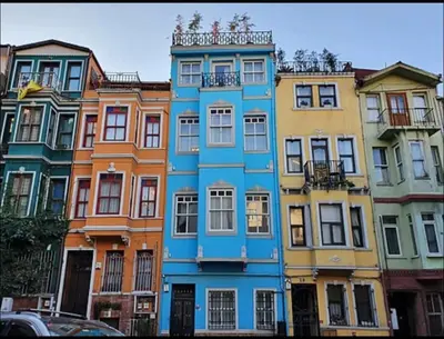 a row of colorful buildings in a city at balatlife suites in Istanbul