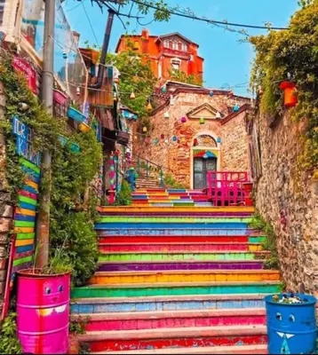 a set of colorful stairs with a building in the background at balatlife suites in Istanbul