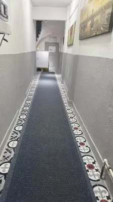 a hallway with ailed floor in a building at balatlife suites in Istanbul