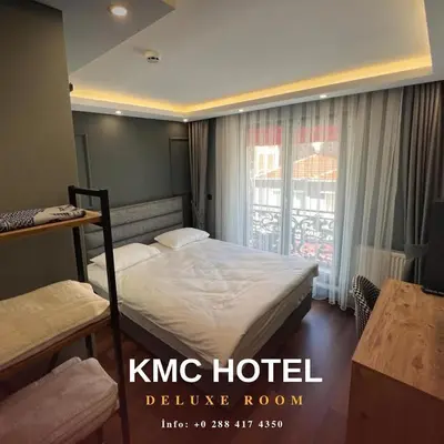 a hotel room with a bed and a window at KMC City Hotel in Lüleburgaz