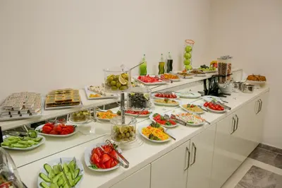 a buffet line with many plates of food on it at Babil Hotel in Istanbul