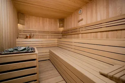 a sauna with wood paneling and a wooden floor at Babil Hotel in Istanbul