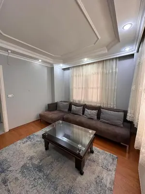a living room with a couch and a coffee table at Metroya 3 dakima uzaklıkta merkezi konumda in Istanbul