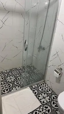 a shower with a glass door in a bathroom at Balat in Istanbul