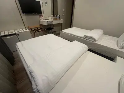 a hospital room with two beds and a television at Actuel Life Hotel in Istanbul
