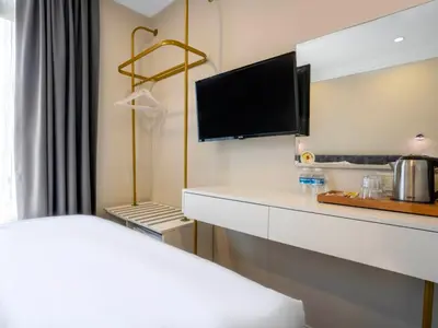 a hotel room with a bed and a flat screen tv at Actuel Life Hotel in Istanbul