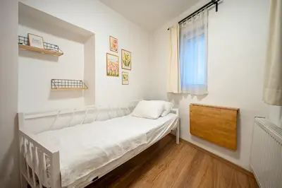 a small bedroom with a bed and a window at Unique 4-Level Home in the Heart of Beşiktaş in Istanbul
