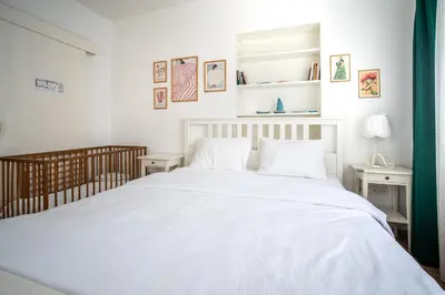 a bedroom with a large white bed with white pillows at Unique 4-Level Home in the Heart of Beşiktaş in Istanbul