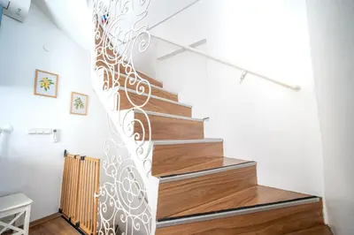 a spiral staircase in a home with a metal railing at Unique 4-Level Home in the Heart of Beşiktaş in Istanbul