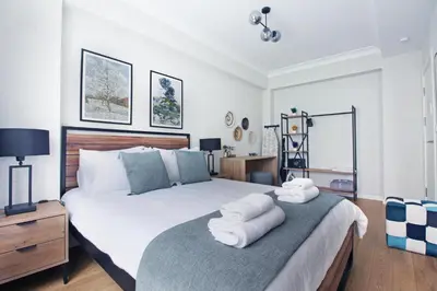 a bedroom with a large bed with towels on it at Excellent Apartments Fatih Citadel in Istanbul