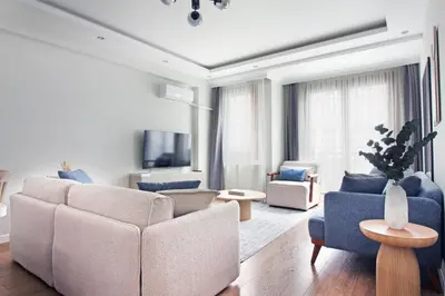 a living room with a couch and chairs and a tv at Excellent Apartments Fatih Citadel in Istanbul