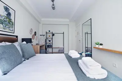 a bedroom with a bed with white towels on it at Excellent Apartments Fatih Citadel in Istanbul