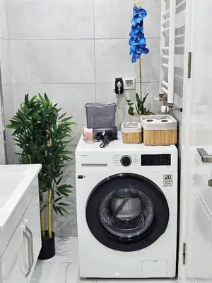 a washer and dryer in a kitchen with a counter at Excellent Apartments Fatih Citadel in Istanbul