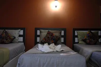 a room with two beds with towels on them at İSTANBUL ESRA Hotel in Istanbul