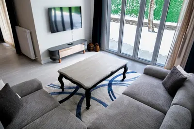 a living room with a couch and a coffee table at Terrazzo Sapanca - Isıtmalı Havuzlu Villa Verde in Sapanca