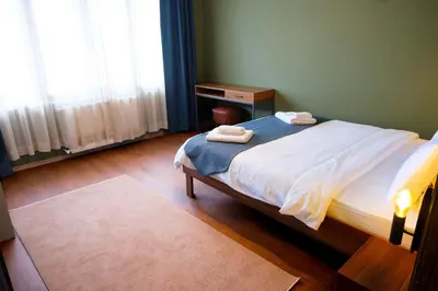 a bedroom with a bed with two towels on it at Terrazzo Sapanca - Isıtmalı Havuzlu Villa Verde in Sapanca
