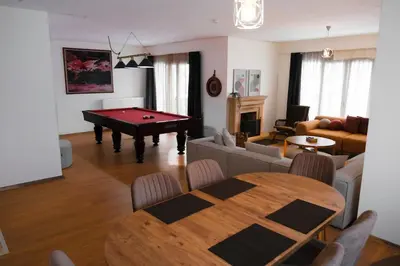 a living room with a pool table in a living room at Terrazzo Sapanca - Isıtmalı Havuzlu Villa Verde in Sapanca