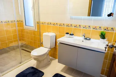 a bathroom with a toilet and a sink and a shower at Terrazzo Sapanca - Isıtmalı Havuzlu Villa Sole in Sapanca