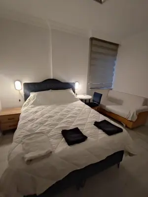 a bedroom with a large bed with towels on it at Üsküdar sahil otel in Istanbul
