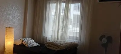 a bedroom with a window with white curtains and a bed at Sağlam Apartments 1 in Istanbul
