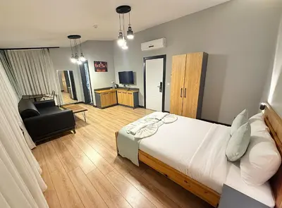 a bedroom with a bed and a chair in a room at Taksim Historical Yellow Hotel in Istanbul