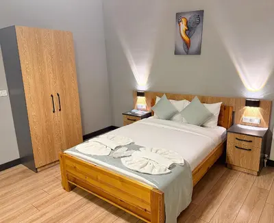 a bedroom with a large bed with two night stands at Taksim Historical Yellow Hotel in Istanbul