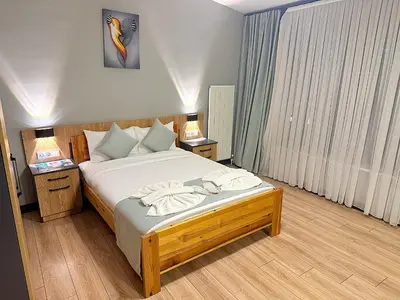 a bedroom with a bed with two towels on it at Taksim Historical Yellow Hotel in Istanbul