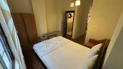 a small room with a bed and a mirror at Sophia bukalemoon apartment in Istanbul