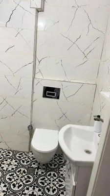 a bathroom with a toilet and a sink at balatlifesuites in Istanbul