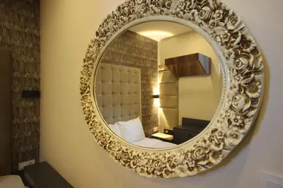 a mirror on a wall in a hotel room at Linada Hotel Taksim in Istanbul