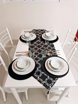 a white table with a black and white table cloth at Apartment with a View Taksim-Beyoğlu1 in Istanbul