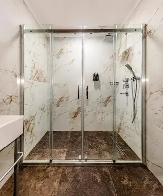 a shower with a glass door in a bathroom at Vox Matara Elite House in Istanbul