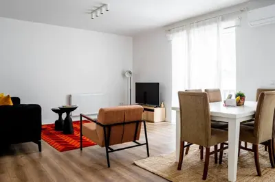 a living room with a white table and chairs at Trendy 2BD Cozy Modern Bebek Home! #415 in Istanbul