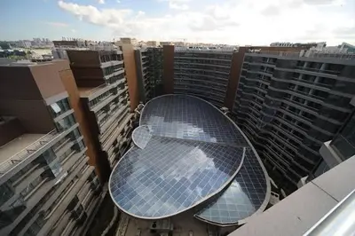 a table on the roof of a building with a lot of windows at Apartment at Prime Istanbul in Istanbul