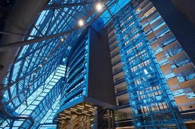 a large building with glass windows and blue ceilings at Apartment at Prime Istanbul in Istanbul