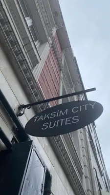 a sign for a taksim city suites on a building at Taksim city suites in Istanbul