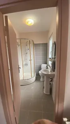 a bathroom with a shower and a toilet and a sink at Taksim city suites in Istanbul