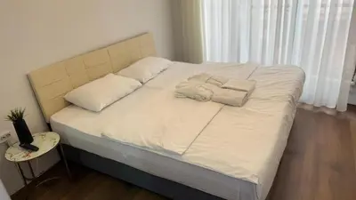 a bed with two towels on it in a bedroom at Balat Life Suites in Istanbul
