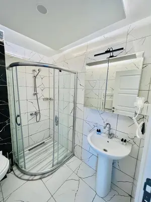 a bathroom with a shower and a sink at Old City Viva Hotel in Istanbul