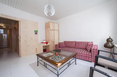 a living room with a red couch and a table at Newly-renovated apartment 1 in Istanbul